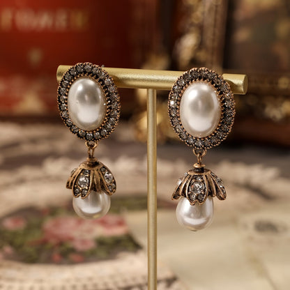 Boucles d'oreilles pendantes vintage en perles encadrées