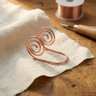 Espiral de mano de cobre Flujo